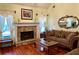 Living room with stone fireplace and hardwood floors at 75 Briar Patch Rd, Covington, GA 30014