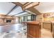 Basement bar with wood counter and stone fireplace at 3171 Beech Dr, East Point, GA 30344