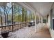 Spacious deck with grill and porch swing overlooking a lake at 4211 Burnt Hickory Nw Rd, Marietta, GA 30064