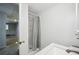 Bathroom with shower, white counter, and open doorway at 4211 Burnt Hickory Nw Rd, Marietta, GA 30064