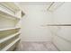 Spacious walk-in closet with built-in shelves and plenty of hanging space at 4211 Burnt Hickory Nw Rd, Marietta, GA 30064