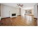 Bright living room with hardwood floors, fireplace, and large windows at 4211 Burnt Hickory Nw Rd, Marietta, GA 30064