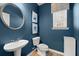 Stylish powder room with dark blue walls and modern fixtures at 367 Morgan Rd, Carrollton, GA 30116