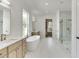 Luxurious bathroom featuring a freestanding tub and walk-in shower at 522 Hope Hollow Ln, Loganville, GA 30052