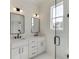 Bright bathroom with double vanity, glass shower, and stylish fixtures at 522 Hope Hollow Ln, Loganville, GA 30052