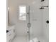 Modern bathroom with a large glass shower, white tile, and updated vanity at 522 Hope Hollow Ln, Loganville, GA 30052