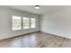 Bright bedroom with hardwood floors and large windows at 522 Hope Hollow Ln, Loganville, GA 30052