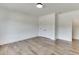 Spacious bedroom with hardwood floors and double doors to closet at 522 Hope Hollow Ln, Loganville, GA 30052
