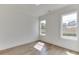 Spacious bedroom with hardwood floors and large windows providing ample natural light at 522 Hope Hollow Ln, Loganville, GA 30052