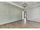 Spacious bedroom with hardwood floors and an accent wall at 522 Hope Hollow Ln, Loganville, GA 30052