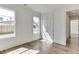 Bright bedroom with hardwood floors, large windows, and access to hallway at 522 Hope Hollow Ln, Loganville, GA 30052