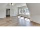 Bonus room with hardwood floors, door to hallway and large windows at 522 Hope Hollow Ln, Loganville, GA 30052