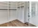 Large walk-in closet with custom built-ins at 522 Hope Hollow Ln, Loganville, GA 30052