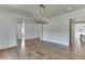 Formal dining room with hardwood floors, chandelier, and views to other rooms at 522 Hope Hollow Ln, Loganville, GA 30052