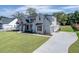 Two-story house with white siding, gray roof, and landscaping at 522 Hope Hollow Ln, Loganville, GA 30052