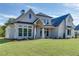 Two-story house with white brick exterior, gray shutters, and a large front yard at 522 Hope Hollow Ln, Loganville, GA 30052