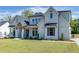 Two-story house with white brick exterior, gray shutters, and a large front yard at 522 Hope Hollow Ln, Loganville, GA 30052