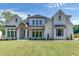 Two-story house with white brick exterior, gray shutters, and a large front yard at 522 Hope Hollow Ln, Loganville, GA 30052