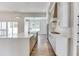 Modern kitchen features a large island, stainless steel appliances, and white cabinetry at 522 Hope Hollow Ln, Loganville, GA 30052