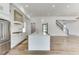 Open concept kitchen features white cabinets, quartz countertops and island at 522 Hope Hollow Ln, Loganville, GA 30052