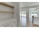 Bright kitchen pantry with white shaker cabinets and quartz countertops at 522 Hope Hollow Ln, Loganville, GA 30052