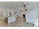 Open concept kitchen with island and views into the living room at 522 Hope Hollow Ln, Loganville, GA 30052