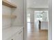 Bright kitchen pantry with white shaker cabinets and quartz countertops at 522 Hope Hollow Ln, Loganville, GA 30052