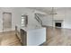 Modern kitchen with a large island, stainless steel appliances, and white cabinetry at 522 Hope Hollow Ln, Loganville, GA 30052