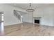 Spacious living area with hardwood floors, a fireplace, and an open floor plan at 522 Hope Hollow Ln, Loganville, GA 30052
