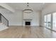 Bright living room features hardwood floors, a fireplace, and large sliding glass doors at 522 Hope Hollow Ln, Loganville, GA 30052