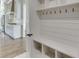 Mudroom with built-in bench, cubbies, and hooks for coats and bags at 522 Hope Hollow Ln, Loganville, GA 30052