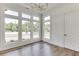 Sunlit office space with hardwood floors and multiple windows offering scenic views at 522 Hope Hollow Ln, Loganville, GA 30052