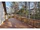 Deck and backyard view of wooded area at 9171 Eves Cir, Roswell, GA 30076