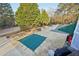 Community pool area with picnic tables and grills at 9171 Eves Cir, Roswell, GA 30076