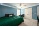 Spacious bedroom with a large green comforter at 260 Shadowbrooke Dr, Loganville, GA 30052