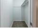 Spacious walk-in closet with shelving and carpeted flooring at 4635 Garden Hills Dr, Stone Mountain, GA 30083