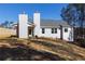 Rear view of a single story house with gray roof and white siding at 40 Eryn Ter, Covington, GA 30014