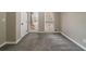 Well-lit bedroom with neutral walls and carpet at 3365 Canary Lake Dr, Duluth, GA 30096