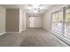 Bedroom with grey carpet, barn door and window at 3365 Canary Lake Dr, Duluth, GA 30096