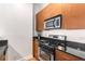 Modern kitchen with stainless steel appliances and wood cabinets at 384 Ralph Mcgill Blvd # 313, Atlanta, GA 30312