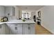 Modern kitchen with gray cabinets, quartz countertops, and an island at 430 Thomas Jefferson Dr, Stone Mountain, GA 30083