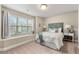 Bedroom with window seat and large window at 4372 Ainsley Mill Ln, Duluth, GA 30097