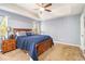 Large main bedroom with carpeted floor, ceiling fan and plenty of natural light at 34 Clay Ct, Villa Rica, GA 30180