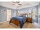 Main bedroom with carpeted floor, ceiling fan and en-suite bathroom access at 34 Clay Ct, Villa Rica, GA 30180