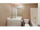 Clean basement bathroom with tub, toilet and vanity at 7860 Wentworth Dr, Duluth, GA 30097