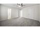 Main bedroom with grey carpet, ceiling fan, and en-suite bathroom at 134 Mill Ct, Dallas, GA 30157