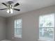 Bright bedroom with a ceiling fan and two large windows with blinds at 355 Pleasant Oak Sw Ct, Marietta, GA 30008