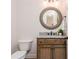 Elegant powder room with granite vanity and decorative mirror at 404 Monarch Lake Dr, Canton, GA 30115