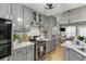 Modern kitchen with gray cabinets and stainless steel appliances at 2745 Chandler Grove Dr, Buford, GA 30519