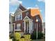 Brick front townhouse with a charming porch and landscaping at 309 Creekbank Se Way, Smyrna, GA 30082